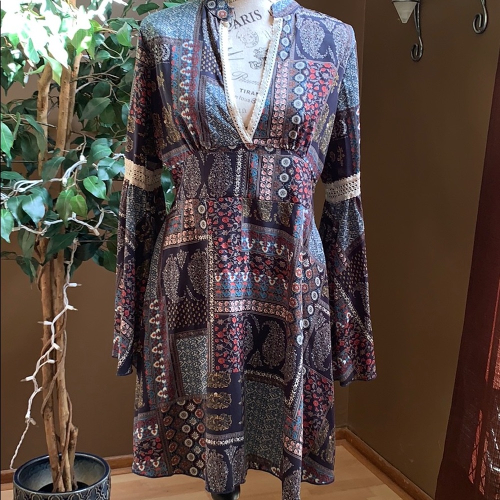 Blue patterned dress with bell sleeves and lace